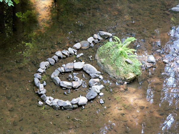 Snail made of river stones in valley Pavlínino údolí.