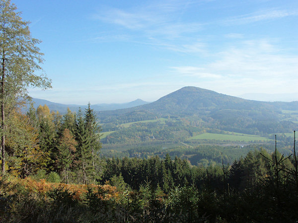 View of the hill Zelený vrch over the ponds Kunratické rybníky to the Jezevčí vrch hill. In the background the Sokol hill near of the village Petrovice is seen.