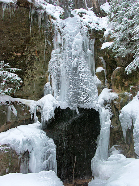 A shield of ice on the surface of the water-fall of the Luční potok-brook.