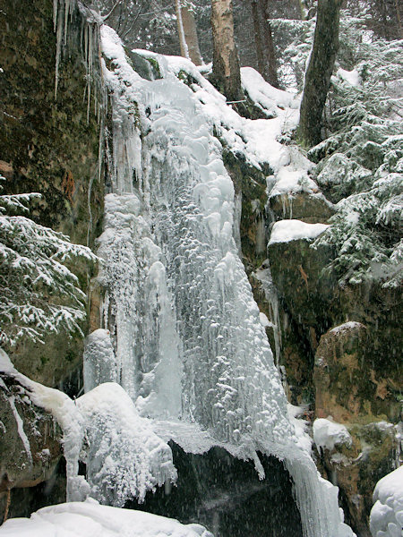 A shield of ice on the surface of the water-fall of the Luční potok-brook.