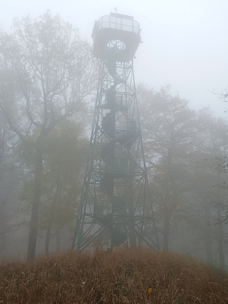 Renovated lookout tower on the Studenec-hill in the fog.