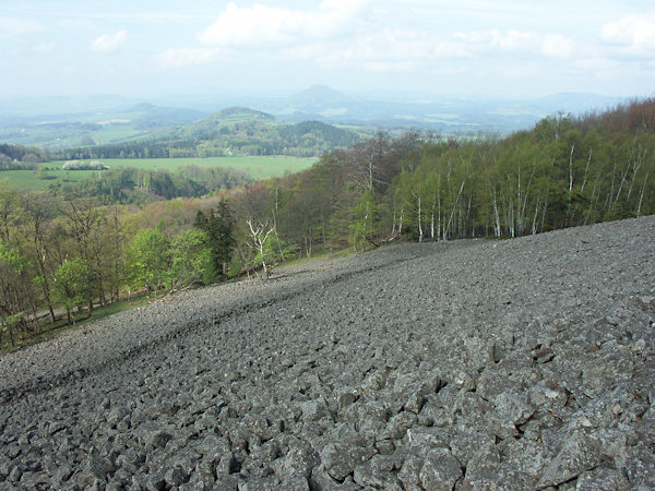 Through a debris field on the southwestern slope of Studenec hill leads a still visible old path.