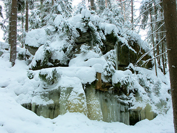 Rock above the frozen waterfall Opona.