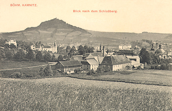 On this picture postcard from 1911 an overall look of the town with the Zámecký vrch-hill in the background is reproduced. In the foreground there are the buildings of the former seignorial farm and of the civic brewery.