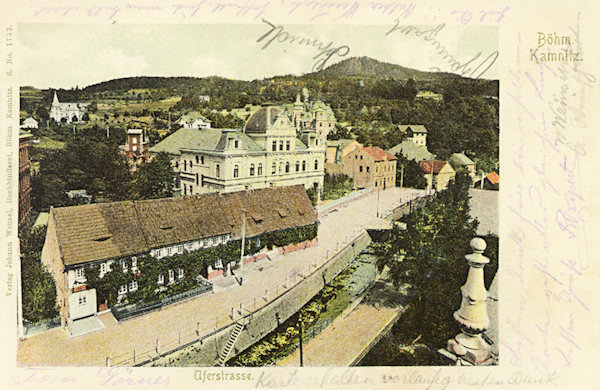 On this picture postcard you see the embankment of the Kamenice brook with the monumental building of the gymnasium and the old timbered houses destroyed by the air raid of May 8, 1945.