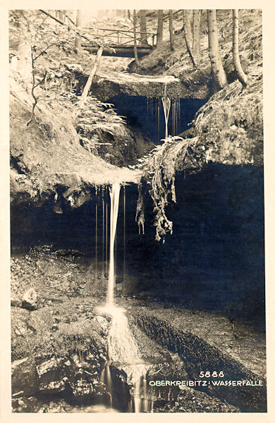This picture postcard from 1929 shows the waterfalls in a wooded valley near Horní Chřibská.