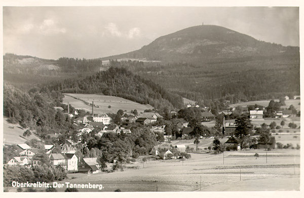 On this picture postcard from 1934 we see Horní Chřibská with the dominant peak of the Jedlová-hill in the background.