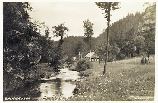 This picture postcard from 1926 shows the romantic valley of the Chřibská Kamenice-brook, with the scattered houses of the at present almost disappeared settlement „Na Potokách“.