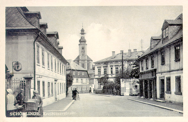 On this picture postcard from the 30es of the 20th century we see the beginning of the road leading from the market place to Chřibská. In front of the church of St. Mary Magdalene on the left side projects the already demolished house of Wiesner's inn into the picture.