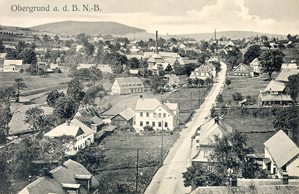 This picture postcard from the first half of the 20th century shows Horní Podluží as viewed from the tower of its St. Catherine Church.