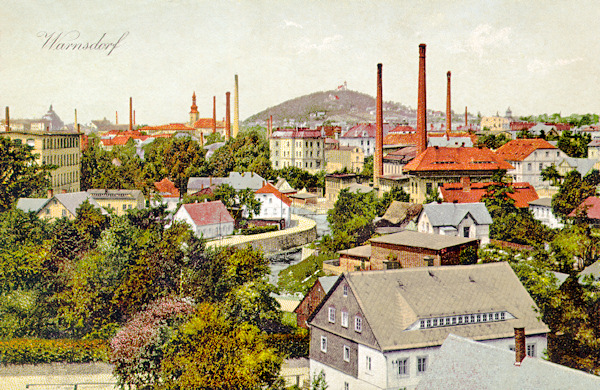 On this picture postcard we see the course of the Mandava brook in the town centre between the streets Husova ulice and Barvířská ulice. In the background there ist the church St. Peter and Paul and the hill Hrádek with the hiker's restaurant.