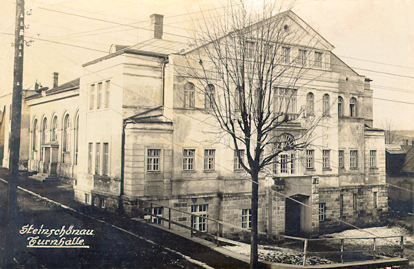 On this picture postcard there is the building of the gymnasium which to the present days remained in its original appearance.
