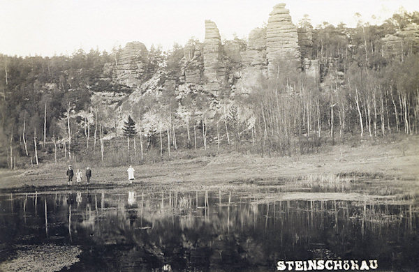 On this picture postcard there are the sandstone rocks at the slope over the bathing pool at Dolní Šenov. On the footpath leading along of the rocks to the top of the hill formerly were the stations of the Cross.