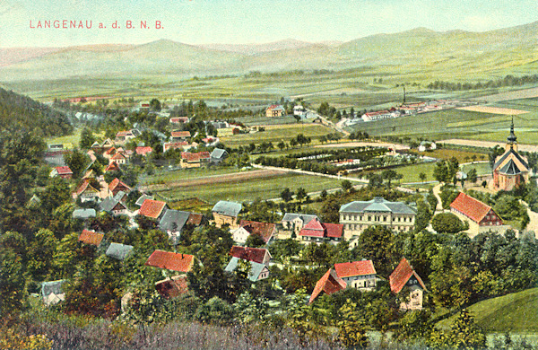 This picture postcard from the beginnings of the 20th century shows the centre of the village as seen from the formerly Mühlberg (mill-hill) called western projection of the Chotovický vrch-hill. The prominent building among the houses in the foreground is the building of the local authority, to the right there is the church St Ann and to the left of it the large cemetery is seen.