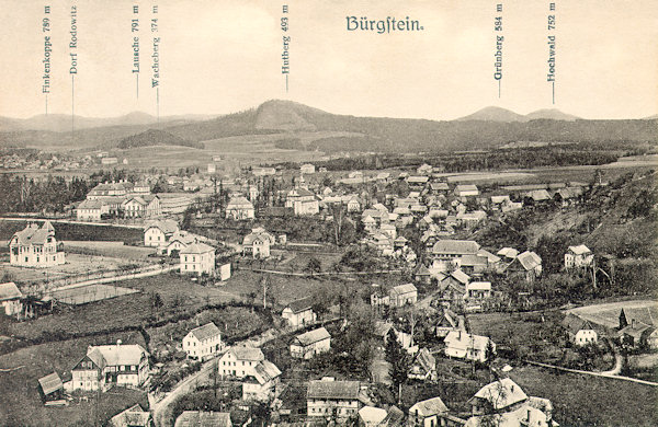 This picture postcard from 1917 shows an overall view of the village of Sloup as seen from the look-out rock Na Stráži. The hills on the horizon are: Pěnkavčí vrch, Luž, Pomahačův vrch near Radvanec village, Strážný, Zelený vrch near Cvikov and Hvozd.