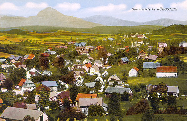 On this picture postcard you see the northern part of the village of Sloup with the profile of the Klíč-hill on the background.