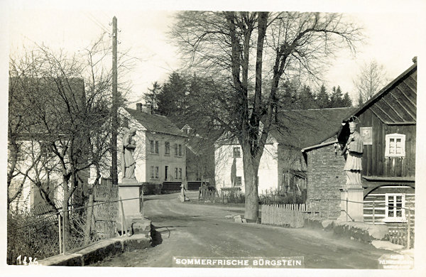 This picture postcard shows the bridge with the sculptures of St. Rosalie and of St.John of Nepomuk on the road to Cvikov. Of the depicted houses only the last one in the left background survived, its look-out, however, had been substantially changed.