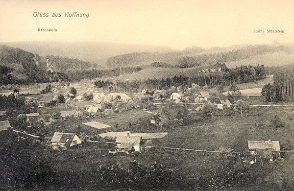 This picture postcard shows the northern part of the village as seen from the Lesní vrch hill. Behind the houses on the left side the rock of the Křížová věž rock is protruding over the wood and on the right side the rock with the ruins of Milštejn castle is seen.