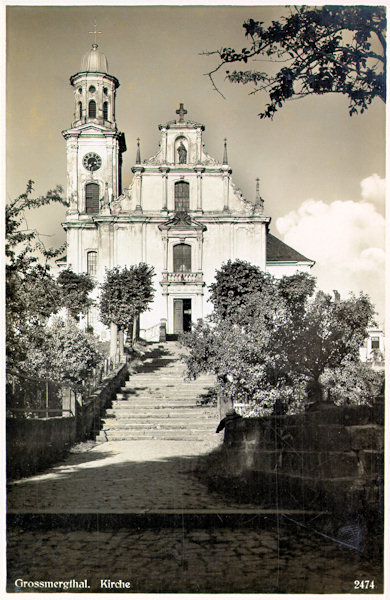 This picture postcard from the years between the wars shows the front of the church of St. Maria Magdalena which in the 80s of the 20th century was condemned to be demolished. Only by the efforts of Marcel Hrubý and by the selfless help of many other enthusiasts it was saved.