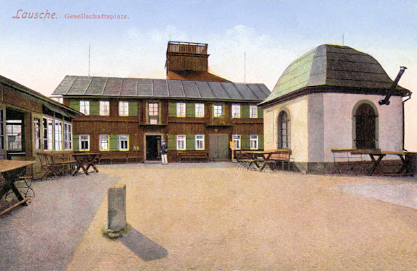 On this picture postcard we see the former restaurant on the peak of Luž hill which was divided by the border-line into a Bohemian (left) and a German (right) part.