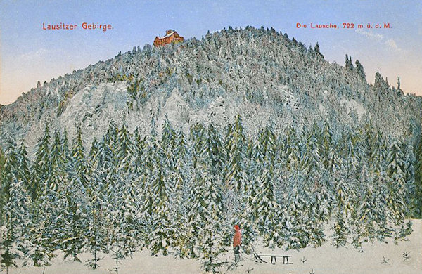 This picture postcard shows the snow-covered cone of the Klíč-hill as seen from the south.