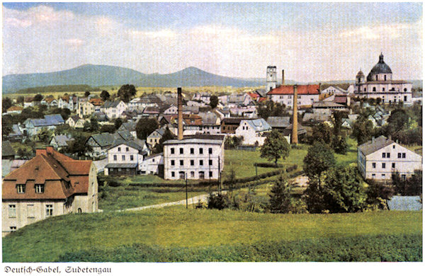 This picture postcard from the end of the thirties of the 20th century shows the view of the town from the south. In the centre there is Joseph Kögler's factory, to the right the cathedral of St. Laurentius and St. Zdislava and to the left of it the former Church of the Virgin. The horizon is closed by the prolonged peak of the Hvozd (In german: Hochwald) and the peak of the Sokol.