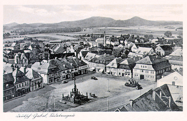 This picture postcard from the years of World War Two shows the market place as seen from the tower of the former town brewery. In the centre of the place there is the group of statues with St. Salvator from 1686 and in the right corner the at present already not existing Kraus' fountain built in 1929.