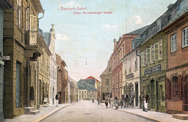 On this coloured picture postcard from the beginning of the 20th century the former road to Zittau and Liberec is shown in its former appearance which we nowadays hardly would be able to recognize.