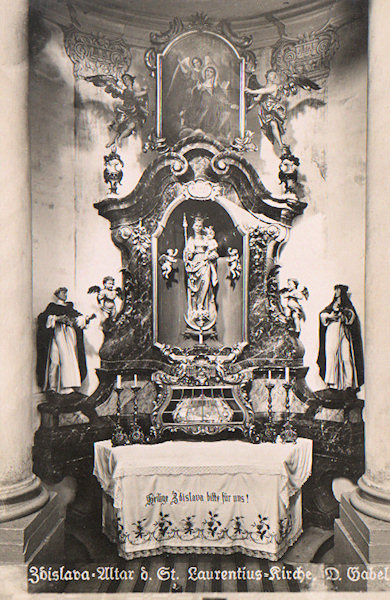 This picture postcard shows the lateral altar with the statue of the Virgin and the relic shrine of St. Zdislava of Lemberk.