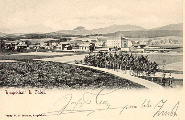 On this picture postcard from the beginning of the 20th century we see the buildings of the heating plant at the railway station of Rynoltice and the prominent building of Schicht's soap factory. In the foreground there is the road to Nová Starost, and on the horizon rise the pointed Sokol and the prolongated ridge of the Hvozd-hill.