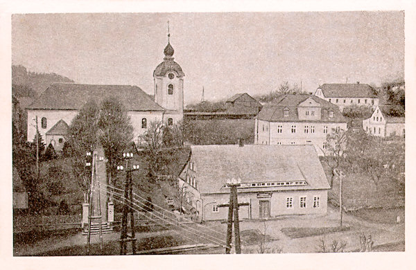 On this picture postcard from the half of the 20th century we see the church of St. Barbara with the two-storeyed house of the presbytery on its right side.